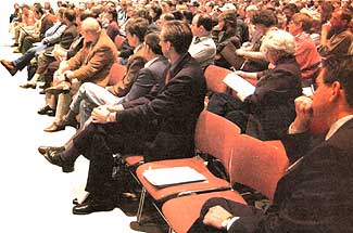 
Audience listens to conference speaker.
